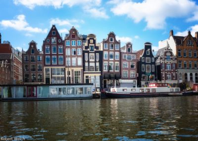 a row of Amsterdam houses all sinking in different directions