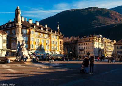 a main piazza in Bolzano with Tyrolean Alps in background