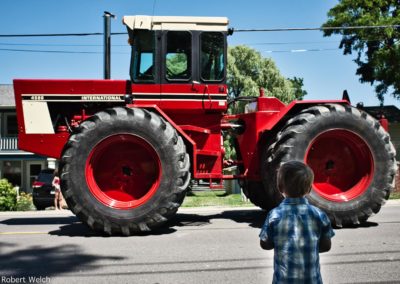 small boy views a monster International tractor
