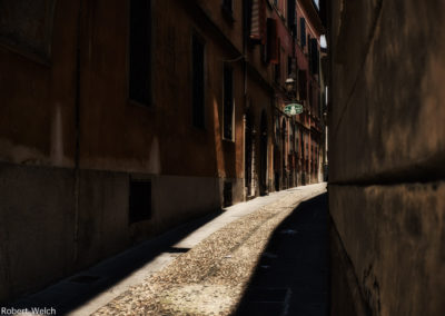 sunlit paving stones in Cremona Italy