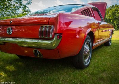 rear quarter view of a red '68 Mustang