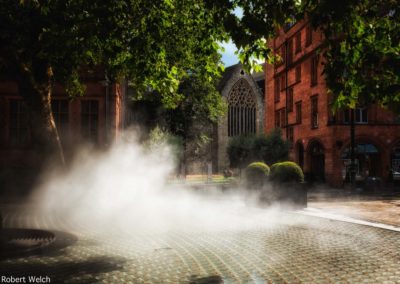mist from a fountain sculpture in Mayfair