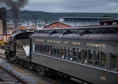 "Central Railroad of New Jersey passenger car behind antique Baldwin locomotive"